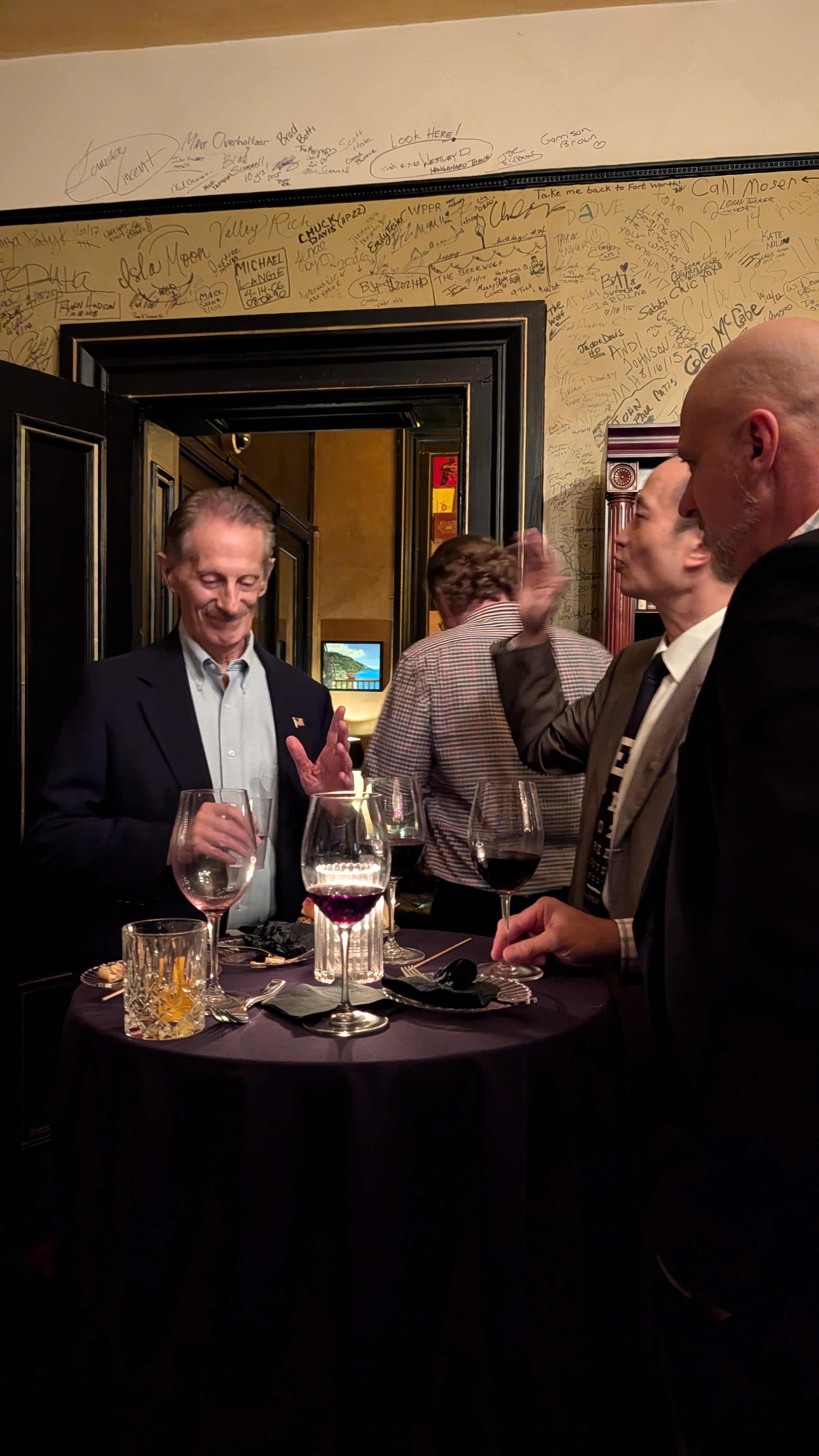 A small group of founders around the wine table
